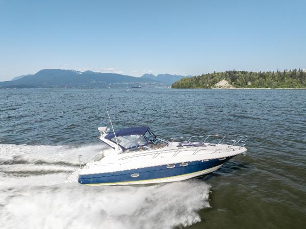 Regal Commodore 3560 IB 2005 Regal Commodore 3560 IB cruising on a scenic lake with mountains in the background.