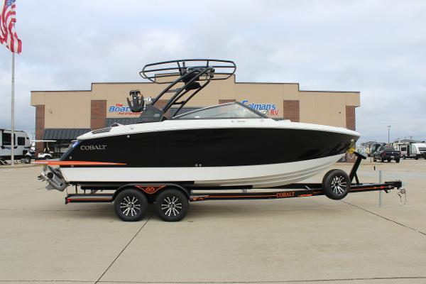 Cobalt R6 2024 Cobalt R6 boat on trailer, parked outside dealership.