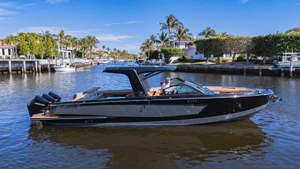 Aviara AV36 OB 2022 Aviara AV36 OB luxury boat cruising on a scenic waterway.