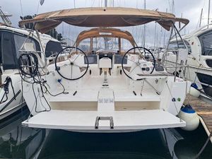 Dufour 382 Grand Large 2016 Dufour 382 Grand Large sailboat docked at marina, featuring dual steering wheels.