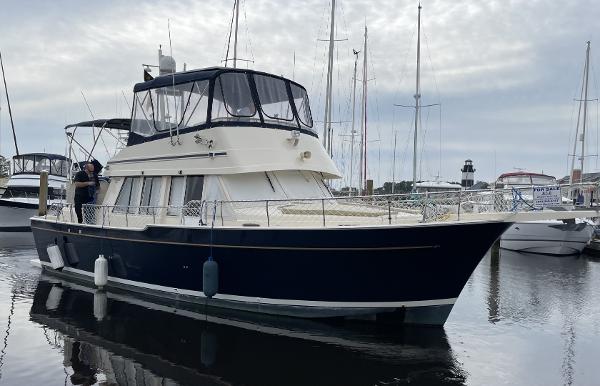 Mainship 430 Aft Cabin 3SR Trawler 2005 Mainship 430 Aft Cabin 3SR Trawler docked in a marina.