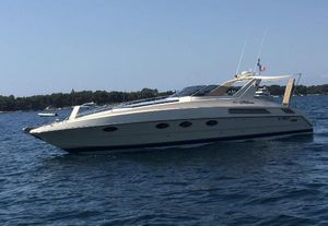 Riva TROPICANA 43 1989 Riva Tropicana 43 yacht on calm water, side view.