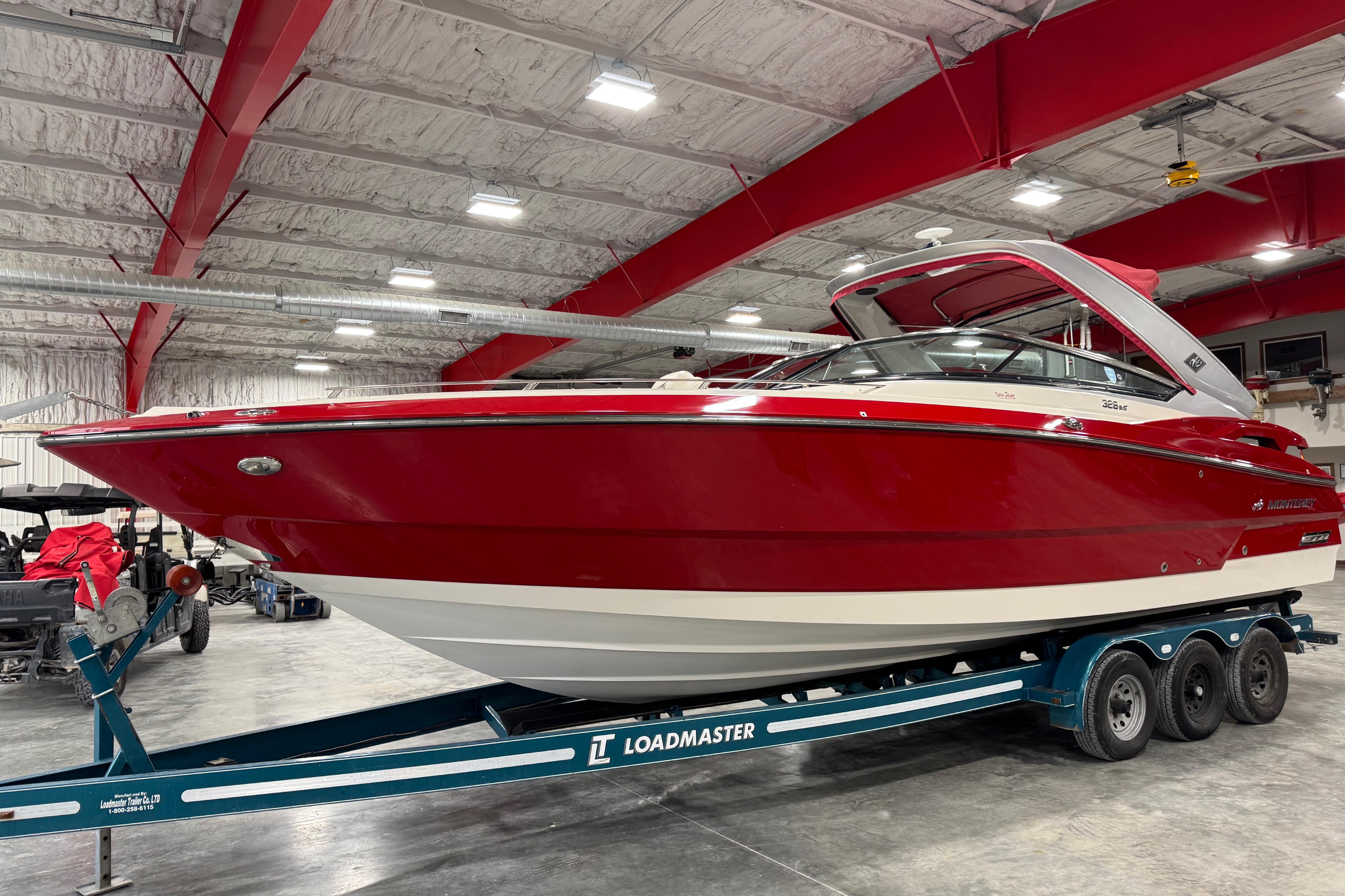 Monterey 328 SS Axius 2012 Monterey 328 SS Axius boat in a warehouse on a Loadmaster trailer.