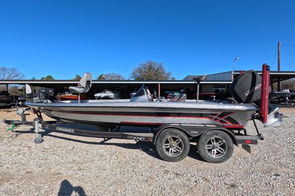 Legend Boats A211 2013 Legend Boats A211 on trailer, parked outdoors under clear blue sky.