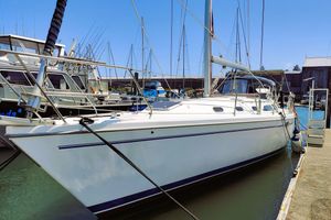 Catalina 42 MkII 2003 Catalina 42 MkII sailboat docked at marina, clear blue sky.