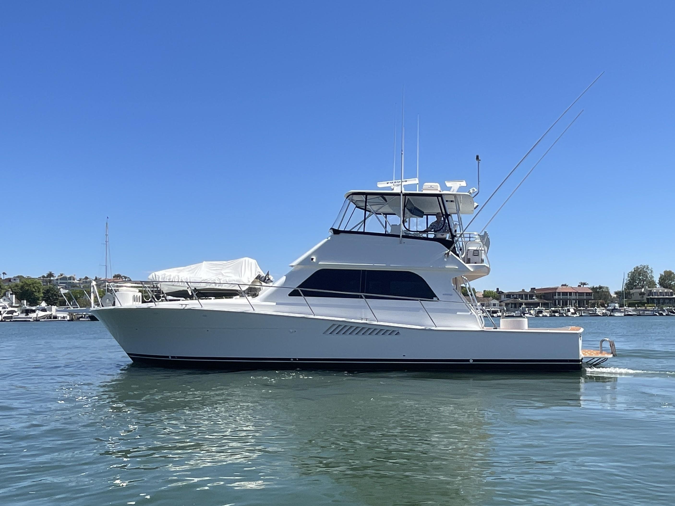 Viking 50 Convertible 1998 Viking 50 Convertible yacht on calm water under clear blue sky.