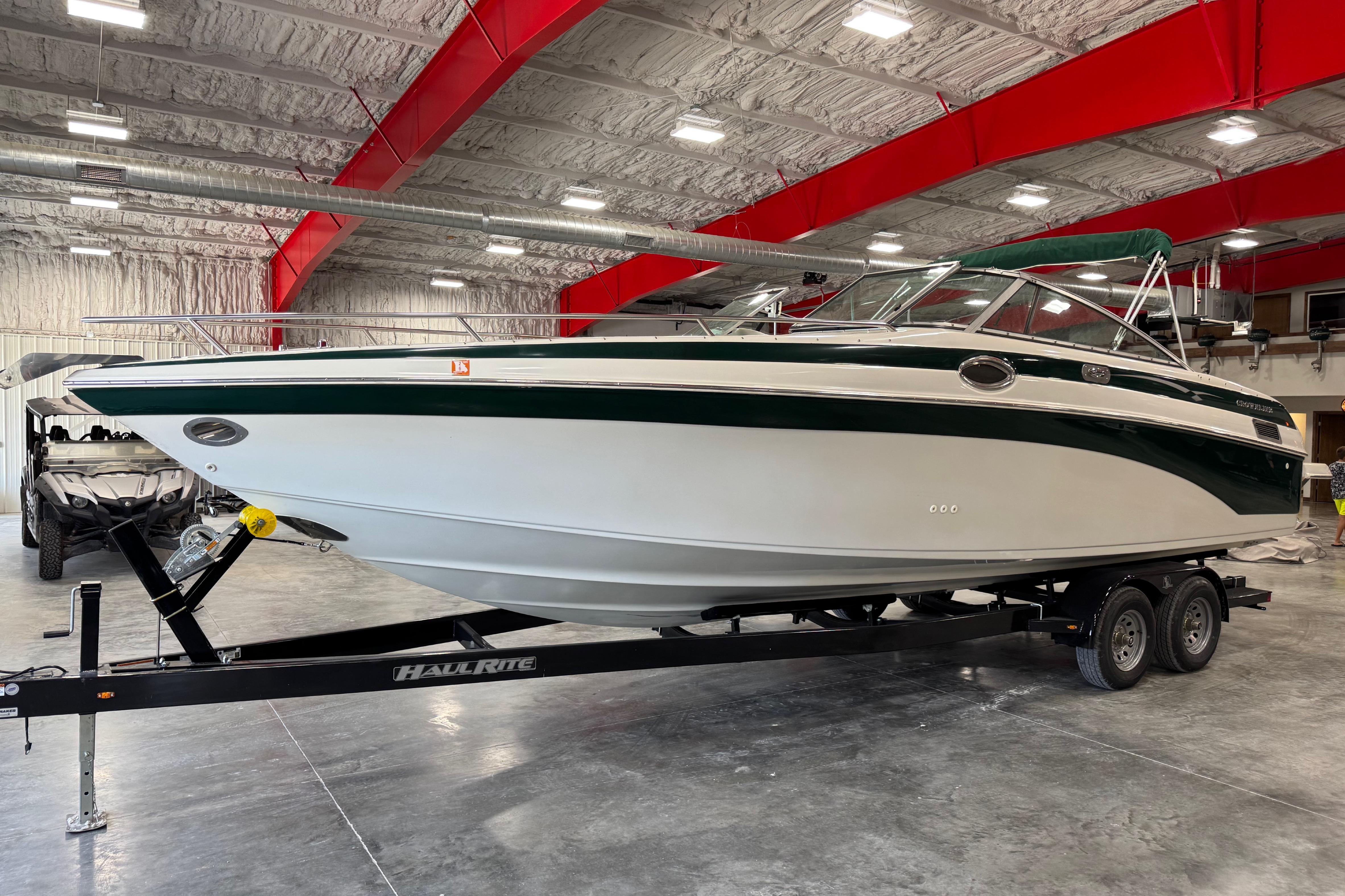 Crownline 288 BR 2001 Crownline 288 BR boat on trailer in indoor storage facility.