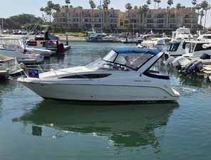 Bayliner 285 Ciera 2005 Bayliner 285 Ciera boat docked in a marina with waterfront buildings in the background.