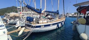 Hallberg-Rassy 42E 1982 Hallberg-Rassy 42E sailboat docked in a marina, surrounded by other boats.