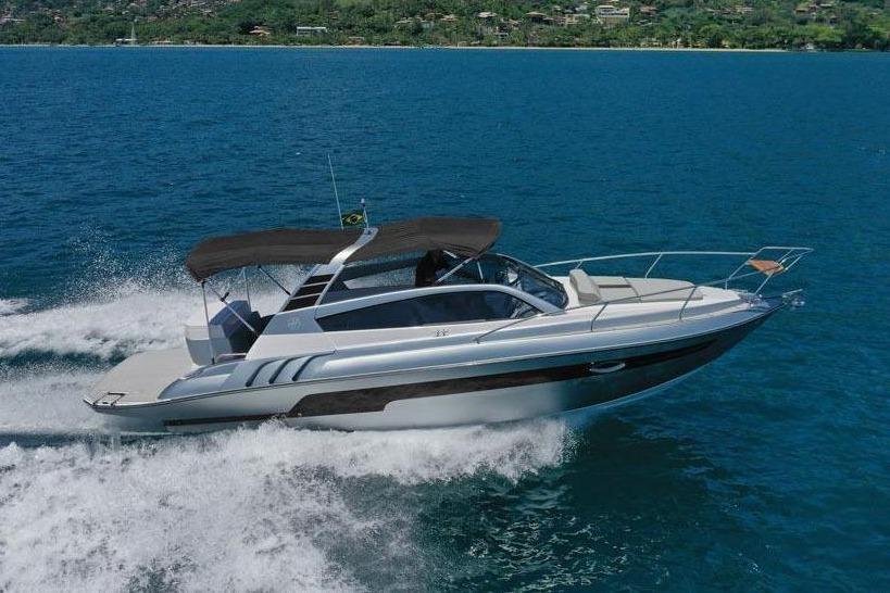 Hanover 305 Inboard 2025 Hanover 305 Inboard boat cruising on blue ocean with scenic mountain backdrop.