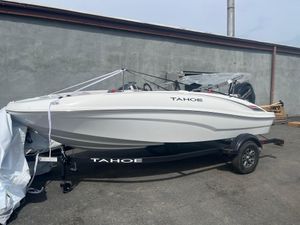 Tahoe T16 2025 Tahoe T16 boat on trailer, parked outdoors, side view.