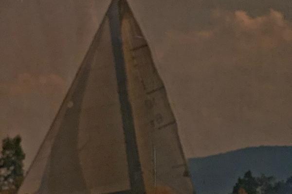 Pearson 38 Sailing boat with large sails, Pearson 38 model, 1963, against a cloudy sky.