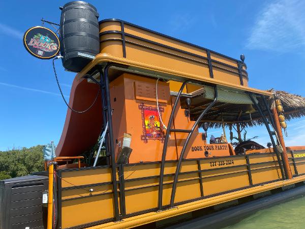 Custom Tiki Bahama Mama 2.0 Custom 2024 Tiki Bahama Mama 2.0 party boat on the water.