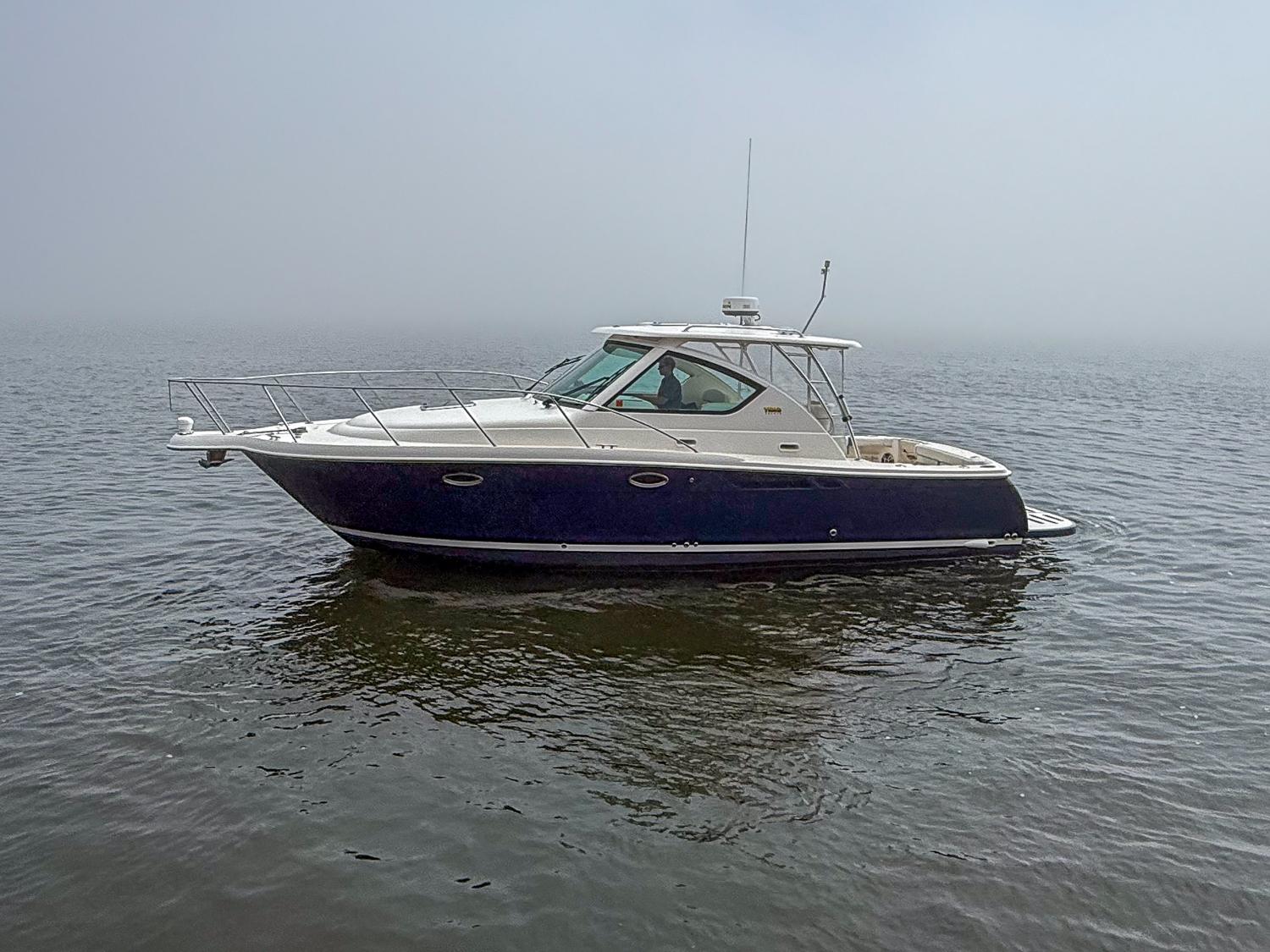 Tiara Yachts 3100 Open 2013 Tiara Yachts 3100 Open boat on calm water, side view.