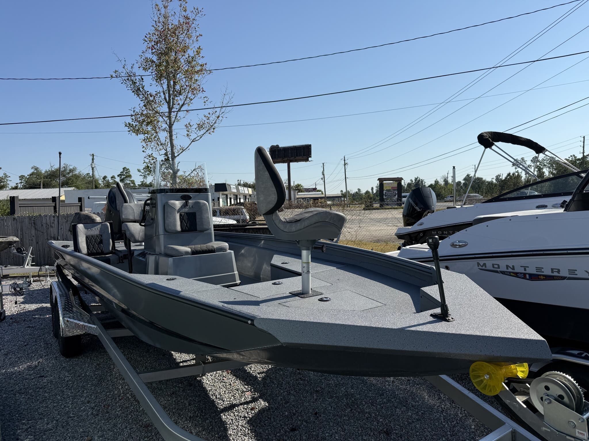 Excel Bay Pro 220 220 ELITE 2026 Excel Bay Pro 220 ELITE boat on trailer, parked outdoors.