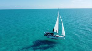 Hunter 340 Sailboat Hunter 340 (1999) cruising on clear turquoise ocean waters.