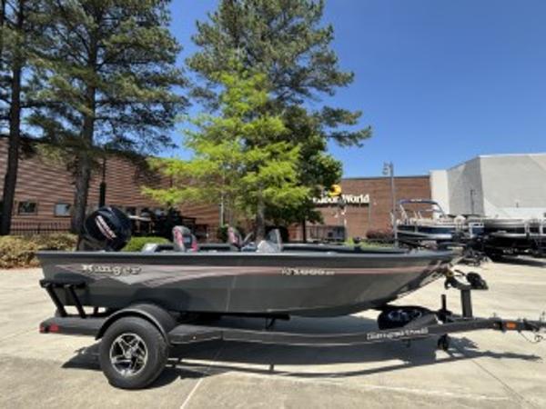 Ranger VS1665SC 2025 Ranger VS1665SC boat on trailer, parked outdoors near trees and buildings.
