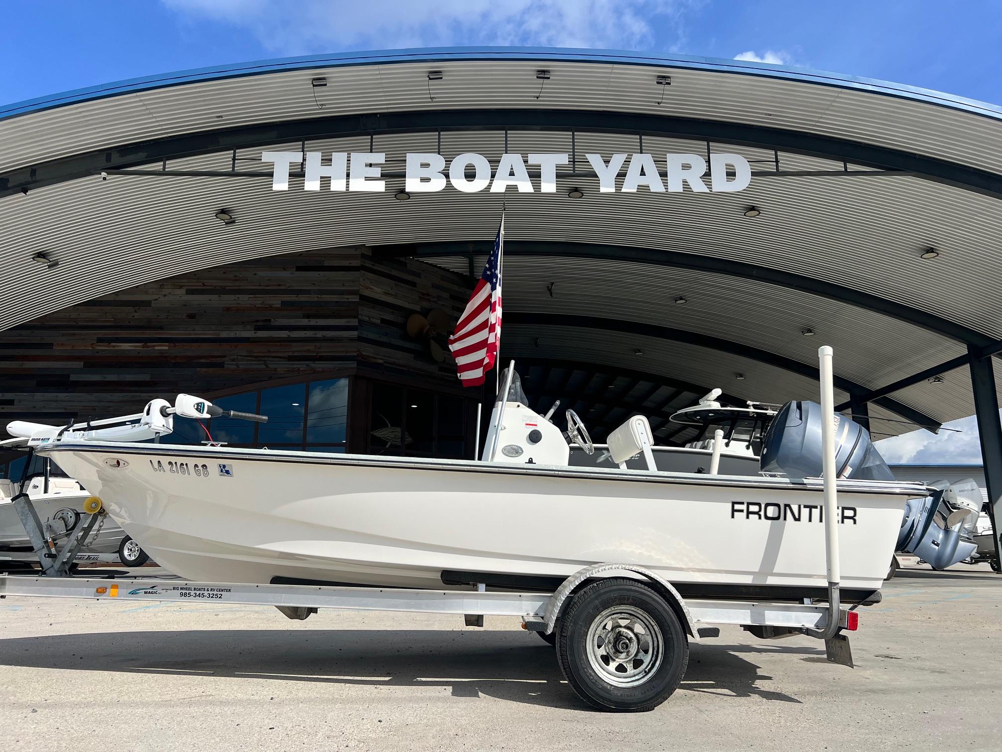 Frontier F-18 2013 Frontier F-18 boat on trailer at The Boat Yard, with American flag.