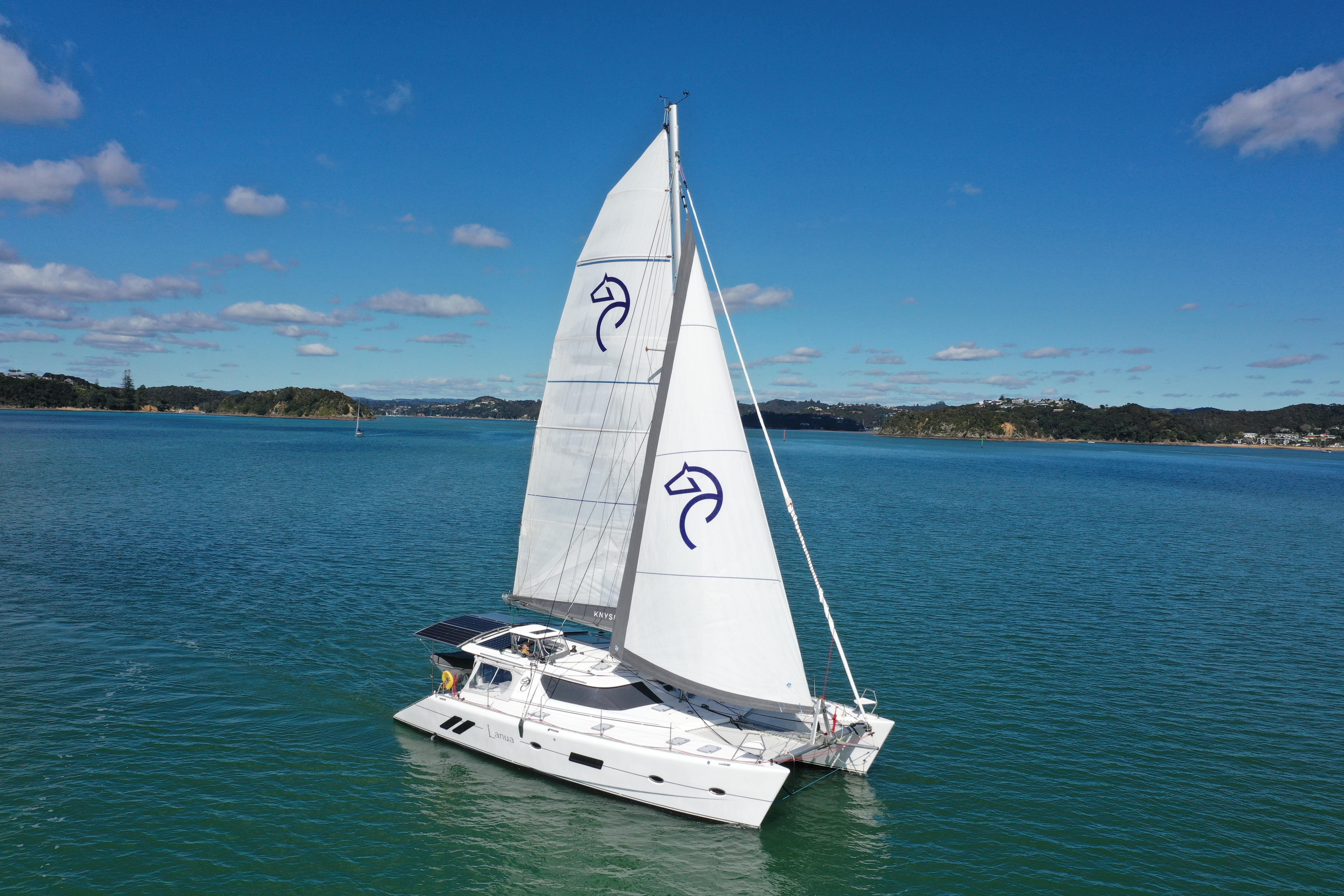Knysna 500 SE 2024 Knysna 500 SE catamaran sailing on a clear blue sea under a sunny sky.