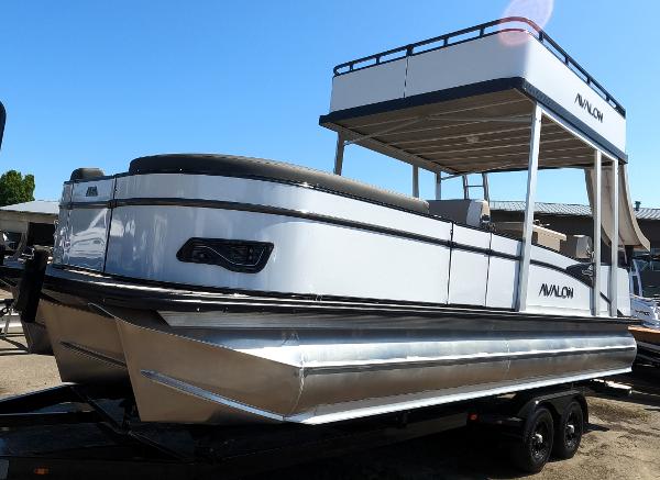 Avalon Catalina Entertainer Funship 2024 Avalon Catalina Entertainer Funship pontoon boat on trailer.