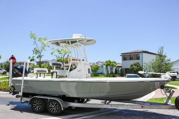 Pathfinder 2300 HPS 2024 Pathfinder 2300 HPS boat on trailer in suburban neighborhood.