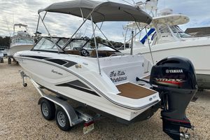 Hurricane SunDeck 235 OB 2023 Hurricane SunDeck 235 OB boat with Yamaha VMAX engine on trailer.
