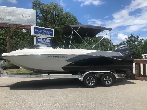 Starcraft svx 211 2024 Starcraft SVX 211 boat on a trailer at Angler's Marine dealership.