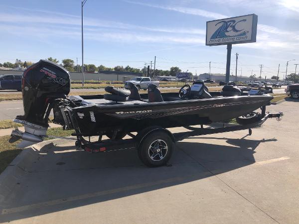 Ranger RT188P 2023 Ranger RT188P boat parked at a dealership under clear skies.