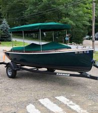 Vision Marine Technologies Fantail 217 2020 Vision Marine Technologies Fantail 217 boat on trailer with green canopy, parked outdoors.