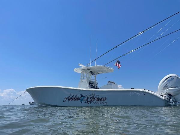 Yellowfin 36 Center Console 2009 Yellowfin 36 Center Console boat on water, clear sky, American flag.