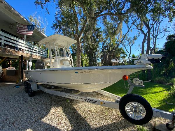 Key West 230 Bay Reef 2017 Key West 230 Bay Reef boat on trailer, parked in a sunny yard.