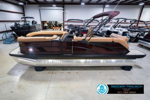 Bennington 22 ML 2026 Bennington 22 ML pontoon boat in showroom, featuring tan seating and sleek design.
