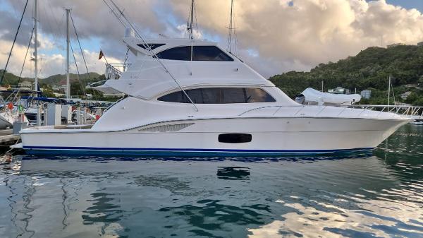 Bertram 700 Enclosed 2009 Bertram 700 Enclosed yacht docked at marina with scenic background.