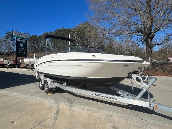 Bayliner VR6 2021 Bayliner VR6 boat on EZ Loader trailer at dealership.