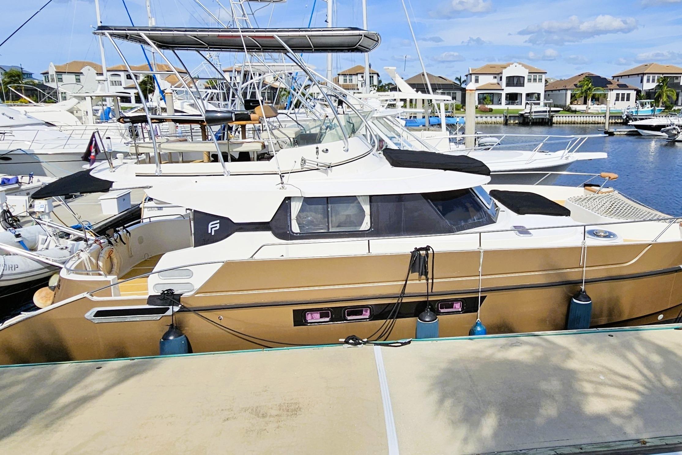 Fountaine Pajot Maryland 37 1999 Fountaine Pajot Maryland 37 yacht docked at marina with clear skies.