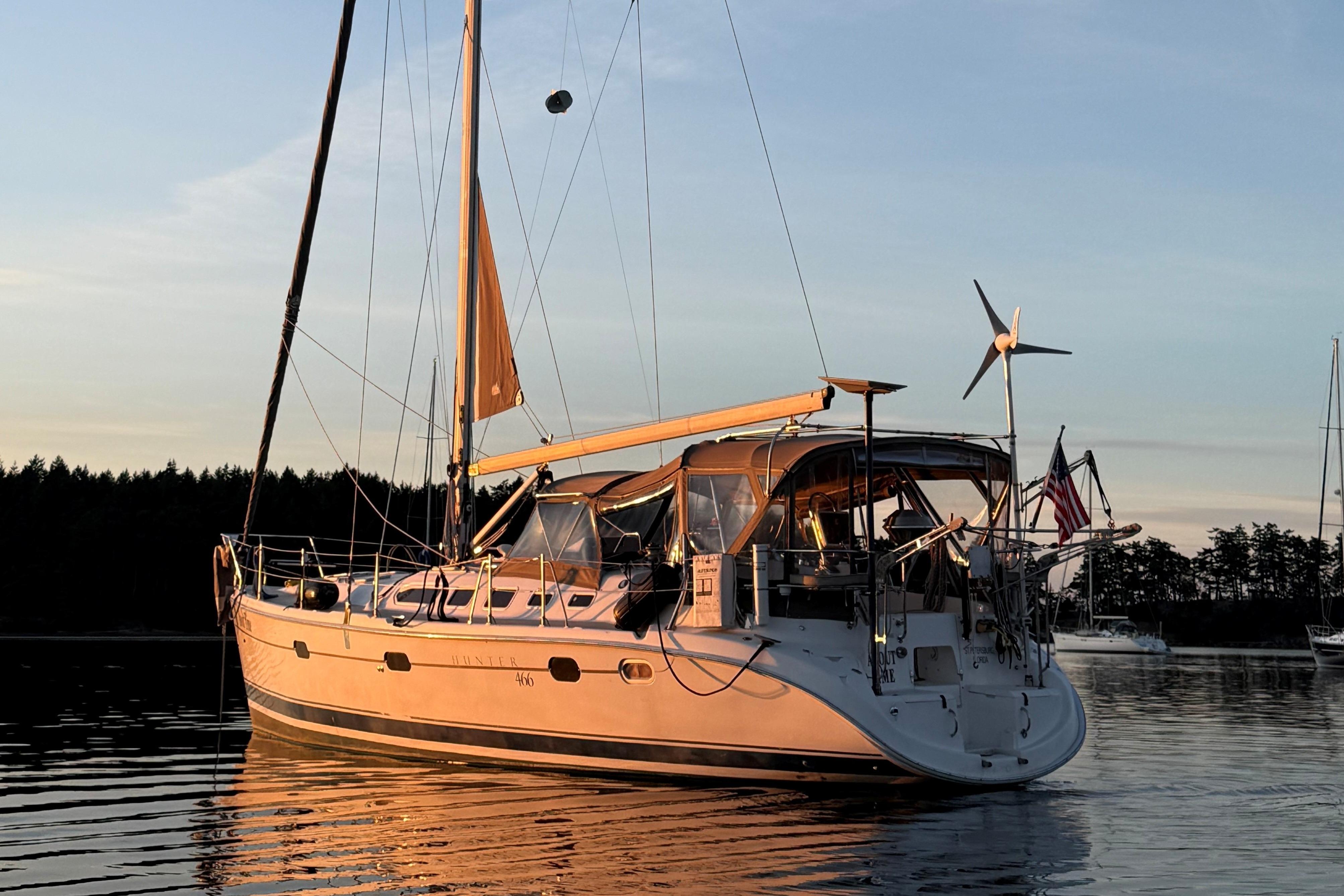 Hunter 466 Sailboat Hunter 466, 2004 model, anchored at sunset on calm water.