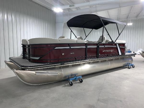 Starcraft SLS 3 2024 Starcraft SLS 3 pontoon boat with maroon exterior in a showroom.