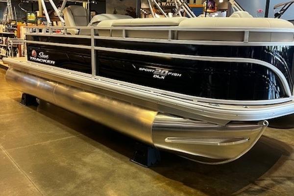 Sun Tracker SportFish 20 DLX 2025 Sun Tracker SportFish 20 DLX pontoon boat displayed indoors.