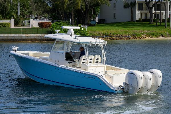 Cobia 350 Center Console 2022 Cobia 350 Center Console boat cruising on a calm waterway.