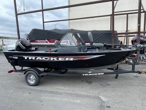 Tracker Pro Guide V-16 WT 2025 Tracker Pro Guide V-16 WT boat on trailer, black exterior, parked outdoors.