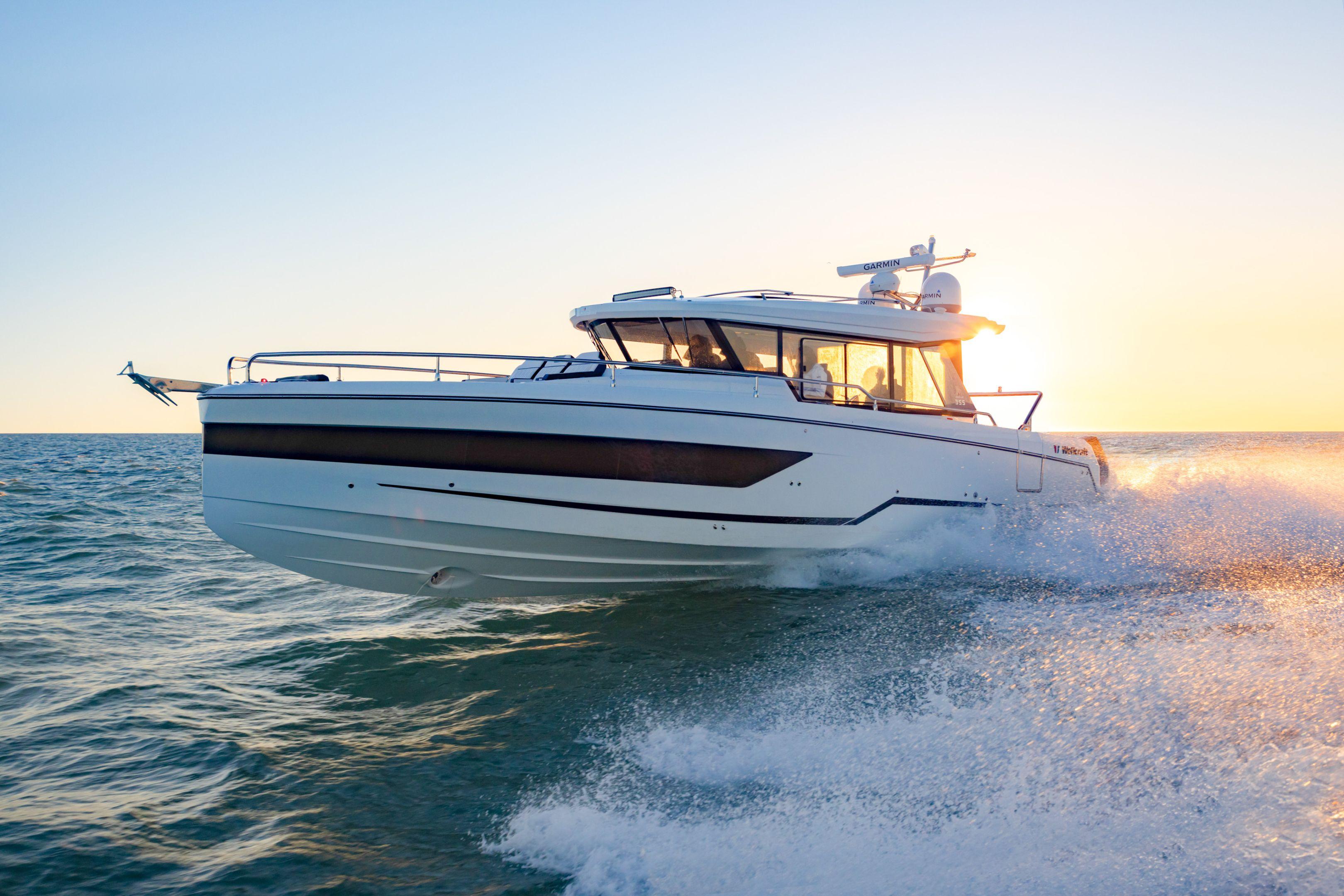 Wellcraft 38 Explorer 2025 Wellcraft 38 Explorer cruising at sunset on open water.