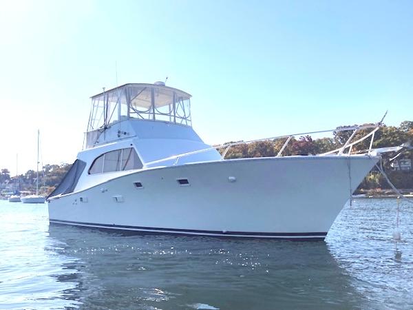 Post 42 Sport Fisherman 1977 Post 42 Sport Fisherman boat on calm water, side view.
