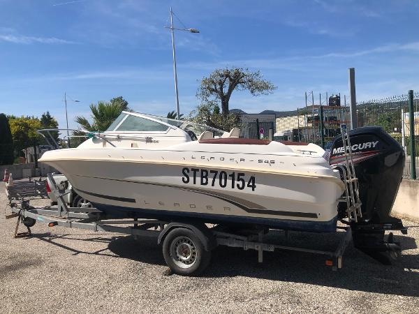 Jeanneau Leader 545 2001 Jeanneau Leader 545 boat on trailer with Mercury outboard motor.