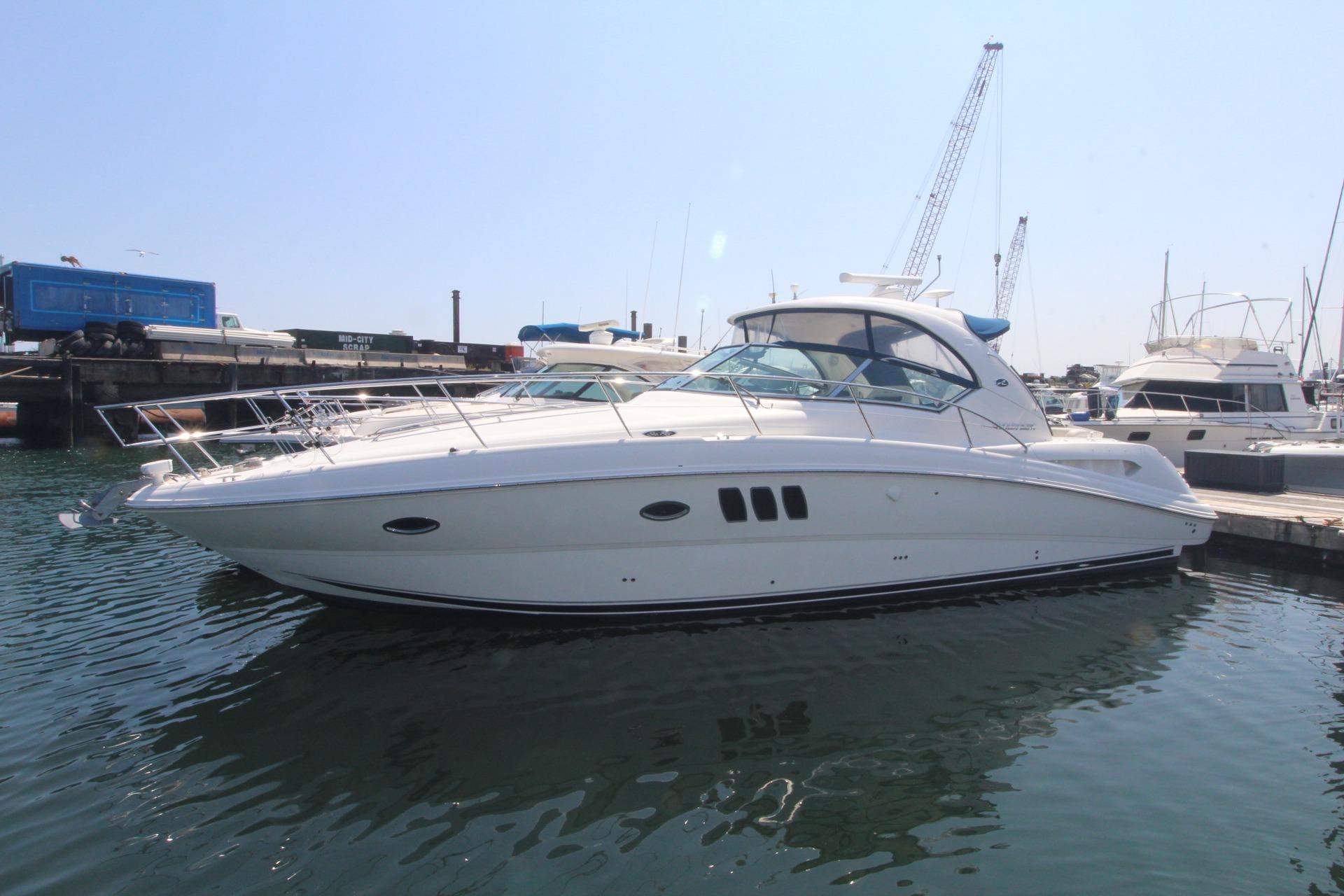 Sea Ray 390 Sundancer 2011 Sea Ray 390 Sundancer yacht docked in marina under clear sky.