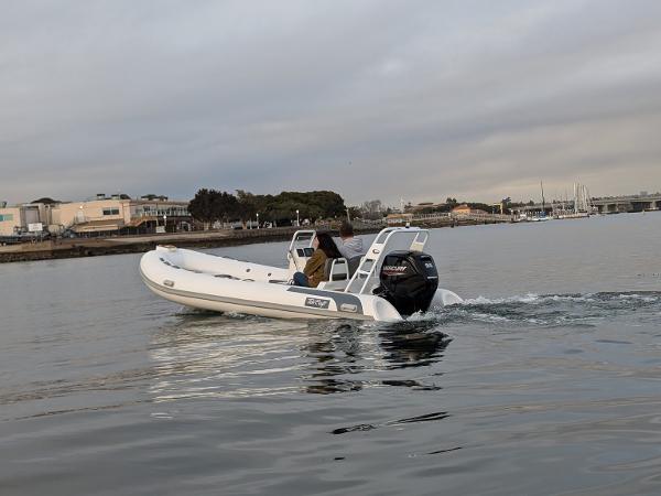 Tide Craft Kodiak 16 2025 Tide Craft Kodiak 16 boat cruising on calm waters near a marina.