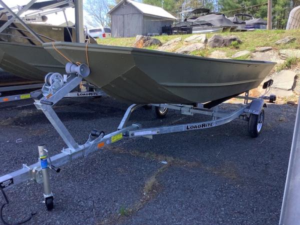 Lund Mod Jon Boat 1448 2024 Lund Mod Jon Boat 1448 on Load Rite trailer, parked outdoors.
