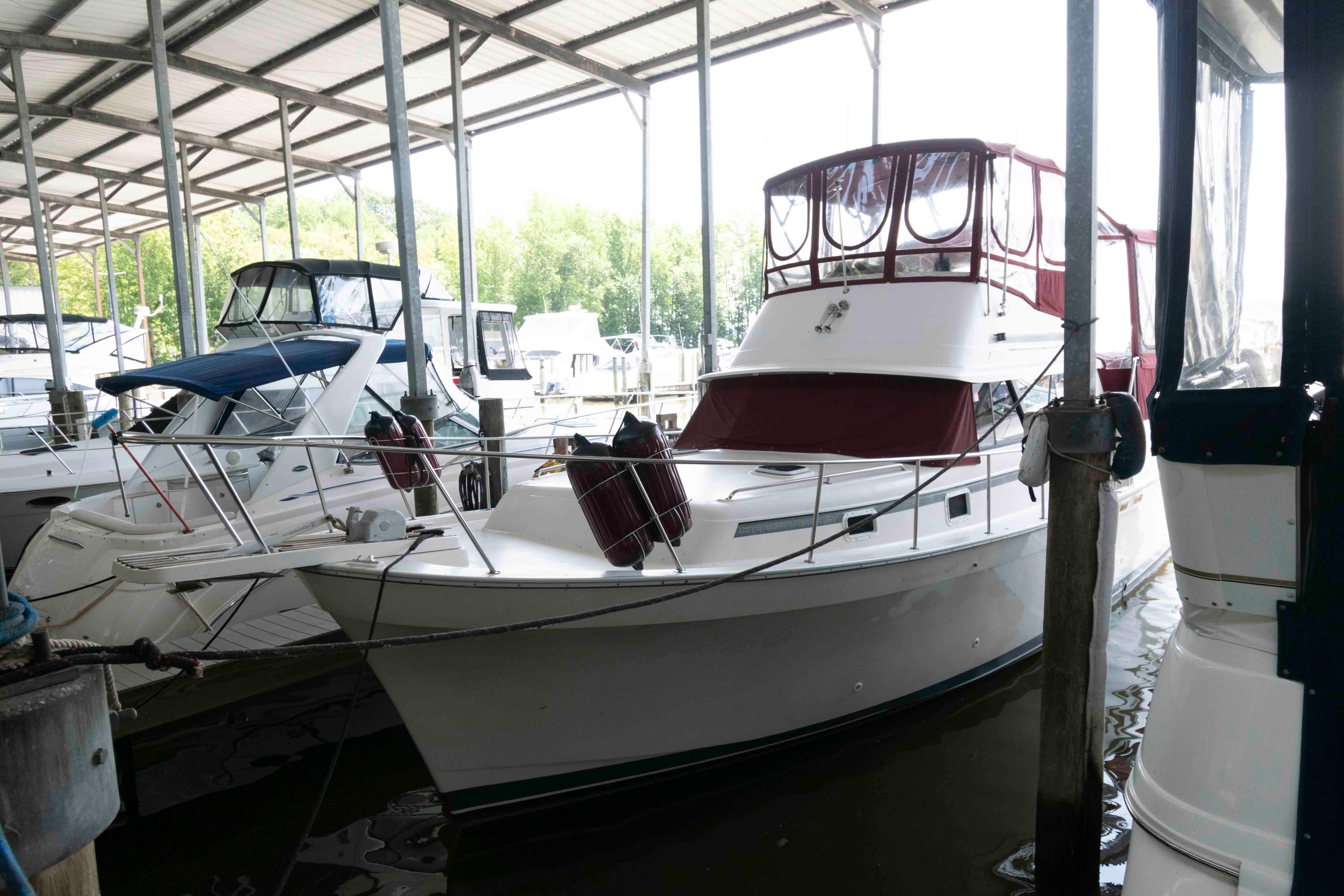 Mainship 36 Double Cabin 1988 Mainship 36 Double Cabin yacht docked in a covered marina.