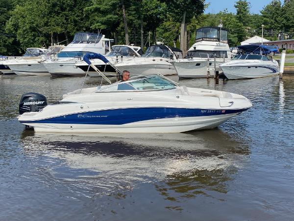 Crownline Eclipse E2 2015 Crownline Eclipse E2 boat on a calm marina with other boats.