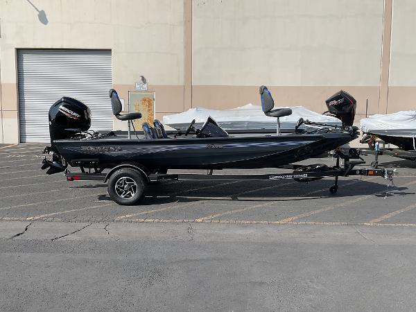 Ranger RT178 2024 Ranger RT178 fishing boat on trailer, parked outdoors.