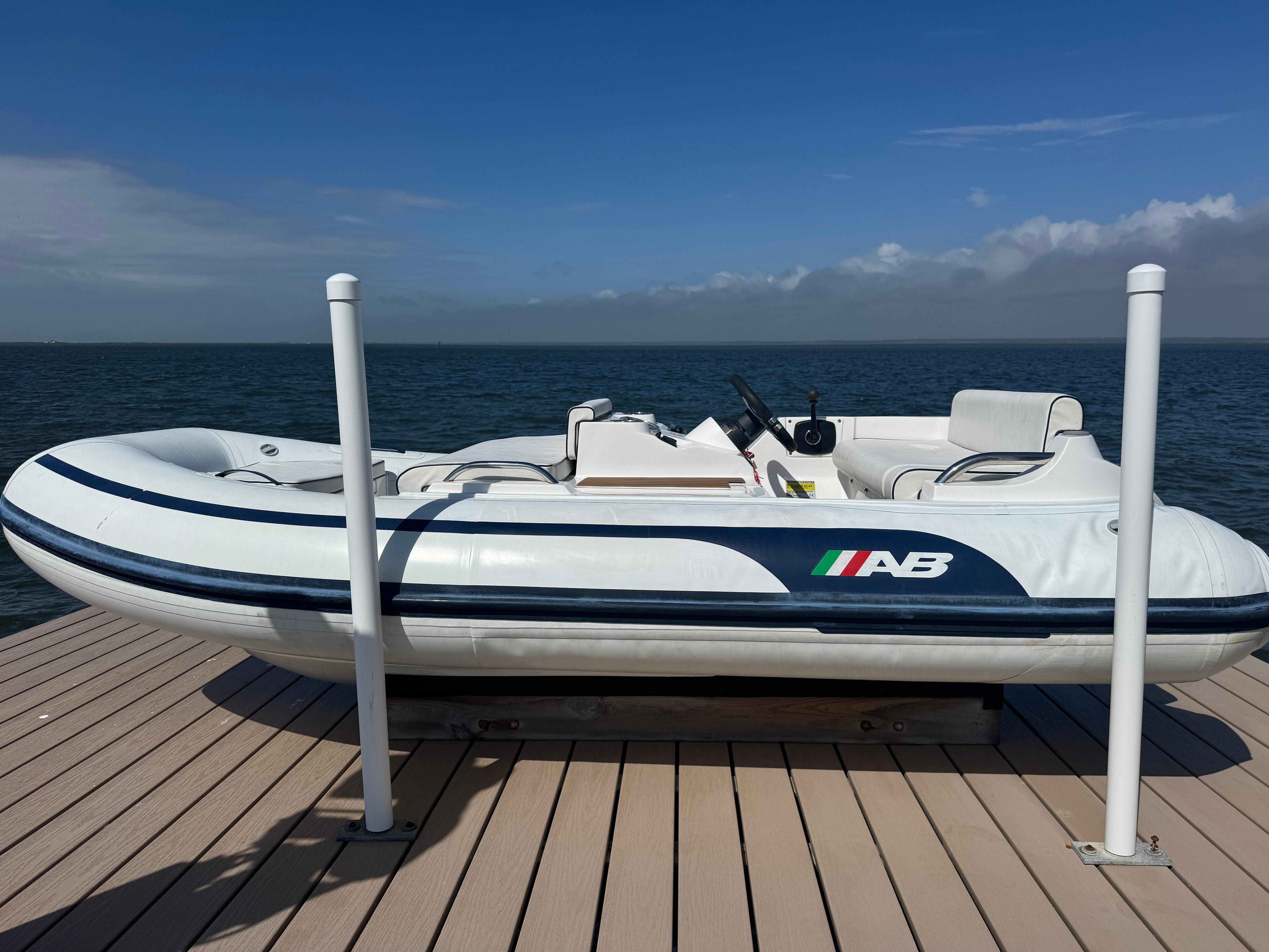 AB Inflatables ABJET 330 2020 AB Inflatables ABJET 330 boat on dock with ocean backdrop.
